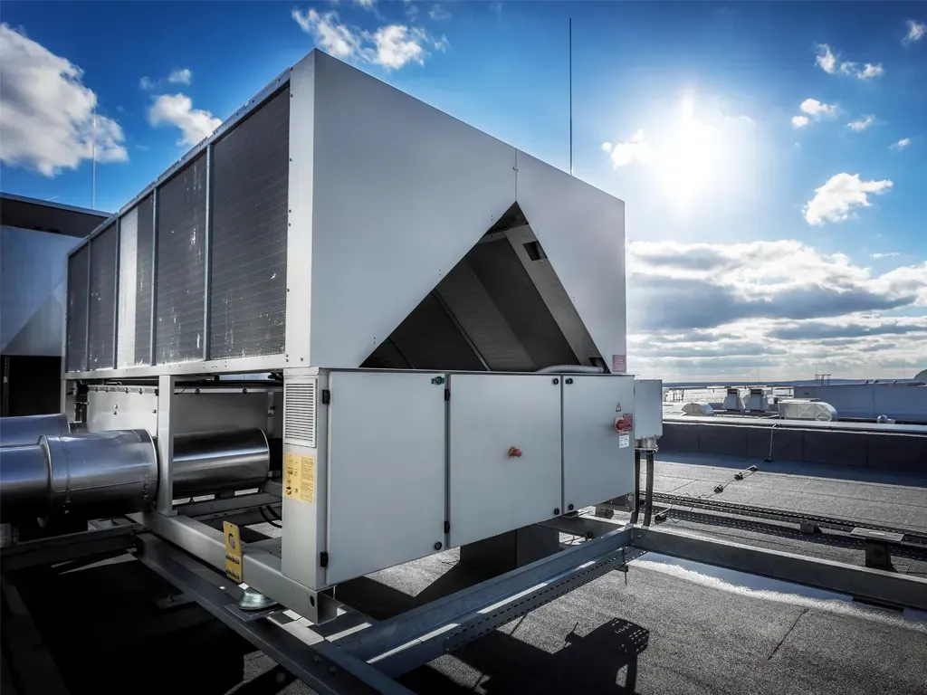 A large commercial rooftop chiller unit installed on a flat roof.